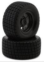 Two black tires with tread pattern on a white background