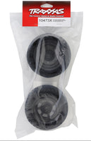 Traxxas wheel hubs in clear packaging with red and white label on a white background