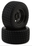 Two black tires with tread pattern on a white background