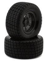 Two black tires with tread pattern on a white background